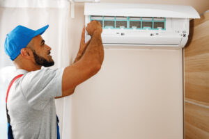 Rsz Professional Repairman Installing Air Conditioner 2023 11 27 05 27 26 Utc, 1st Response Heating &amp; Air Solutions